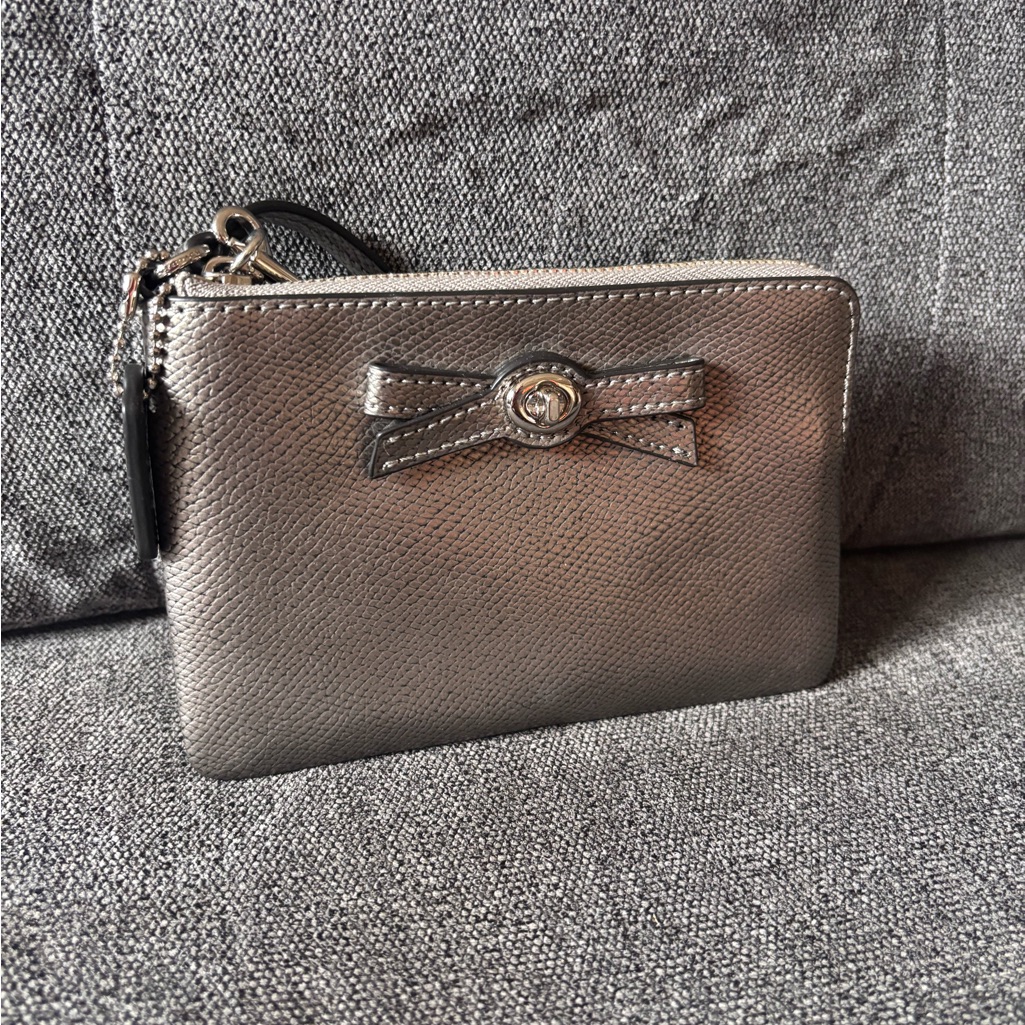 Coach Metallic Silver Bow Turn Lock Wristlet